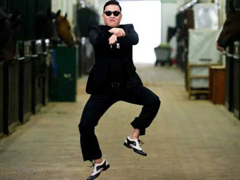 a man in a black shirt and jeans jumping a skateboard .png