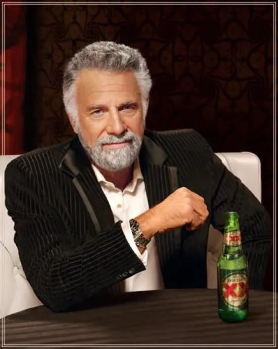 a man sitting at a table with a bottle of beer .png